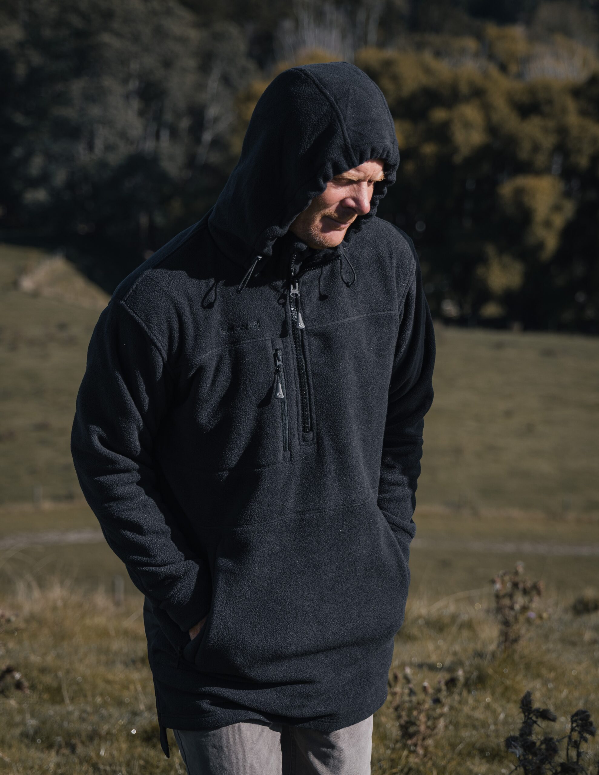 BetacraftWinter26QuestFleeceBlackBushshirtlifestyleshotwithhoodup.jpg